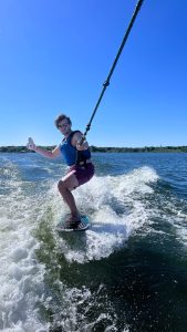 a person riding a board on a body of water